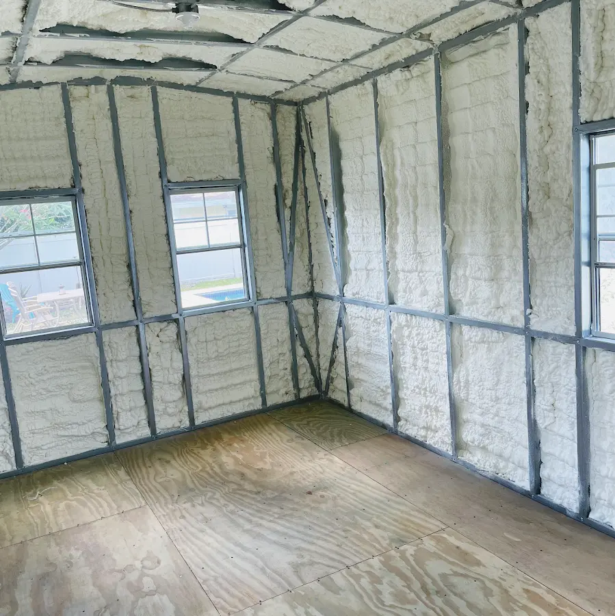 Closed-cell spray foam insulation applied to wall cavities in a residential project in Sauk Rapids